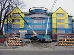 Construction progresses on the back of building. by Marc Featherly