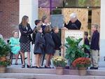 Glass panel is presented to Ames' grandchildren at Dedication.